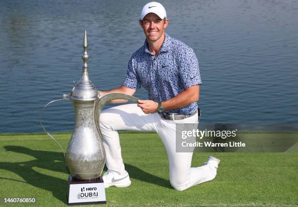 Rory McIlroy of Northern Ireland poses with the Hero Dubai Desert Classic trophy on the 18th green, following victory in the Final Round on Day Five...