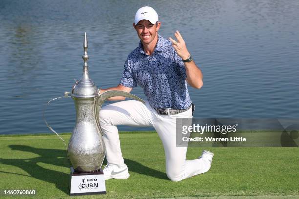 Rory McIlroy of Northern Ireland poses with the Hero Dubai Desert Classic trophy on the 18th green, following victory in the Final Round on Day Five...