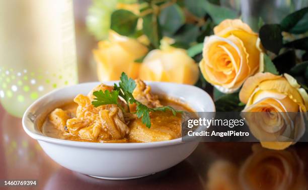 still life with a monkfish stew with potatoes. - kartoffelblüte nahaufnahme stock-fotos und bilder