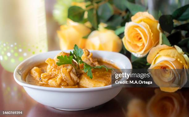 still life with a monkfish stew with potatoes. - stew stock pictures, royalty-free photos & images
