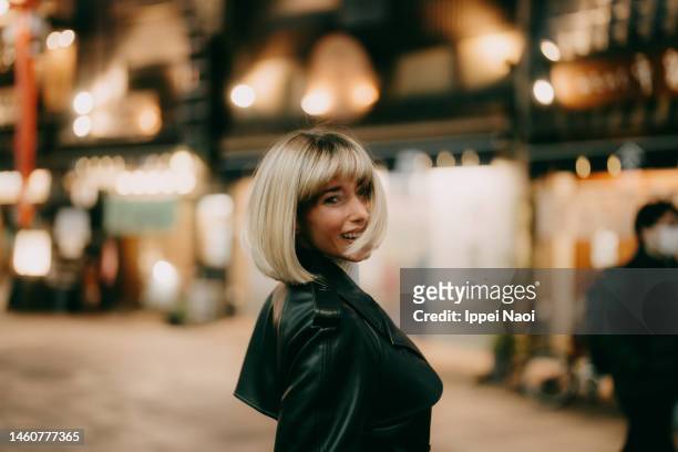 woman in tokyo at night in winter - tokyo japan night alley stock pictures, royalty-free photos & images