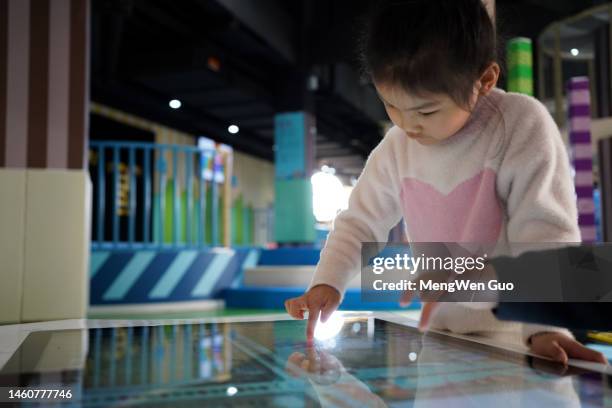 happy asian child using computer screen to draw - paint microsoft stock pictures, royalty-free photos & images