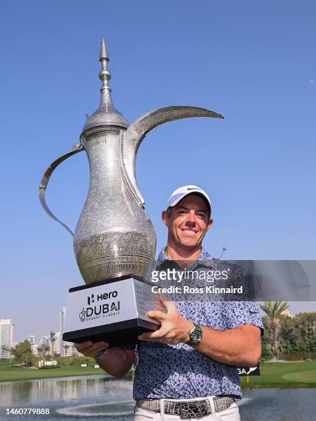 Rory McIlroy of Northern Ireland lifts the Hero Dubai Desert Classic trophy on the 18th green, following victory in the Final Round on Day Five of...