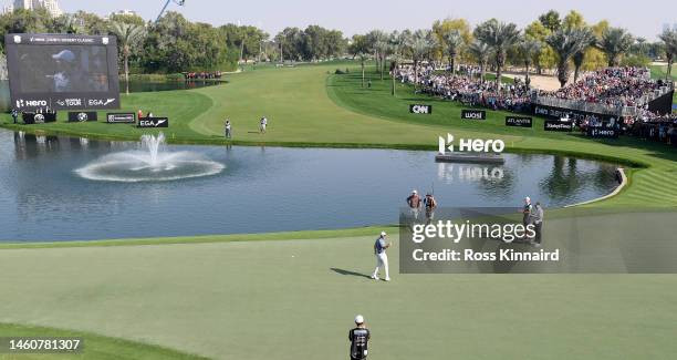 Rory McIlroy of Northern Ireland celebrates after holing the winning putt on the 18th green during the final round of the Hero Dubai Desert Classic...