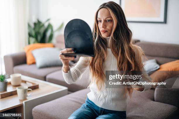 woman adjusting her wig after hair loss due to cancer illness. - toupee stockfoto's en -beelden