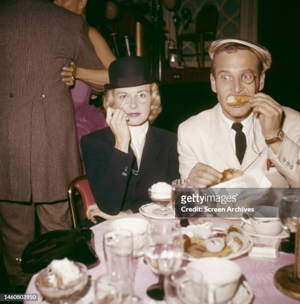 Paul Newman and Joanne Woodward having fun at Hollywood Halloween fancy dress ball 1957.