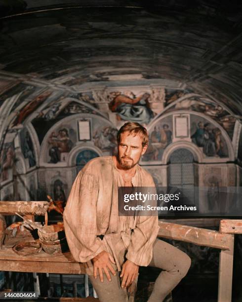 Charlton Heston as Michelangelo from the 1965 movie 'The Agony and the Ecstasy' sitting in the Sistine Chapel.