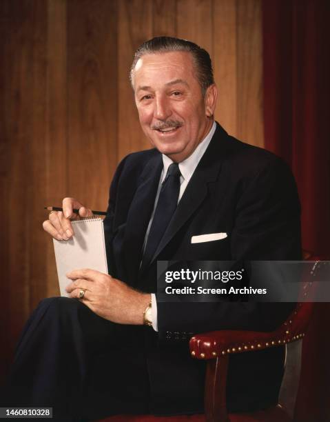 Walt Disney, American animator, film producer and entrepreneur smiling in a promotional portrait, circa 1955.