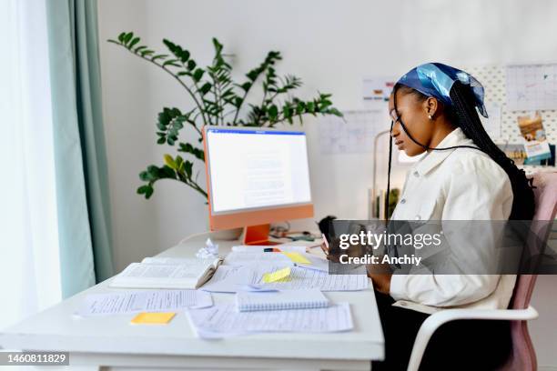 young woman studying for her exams - hybrid learning stock pictures, royalty-free photos & images