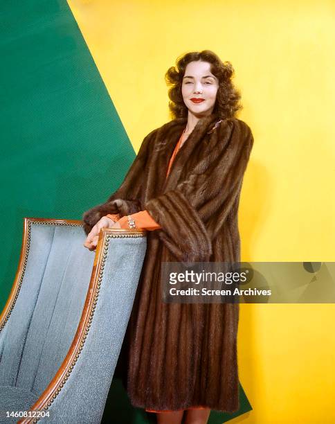 American actress Jennifer Jones in a fur coat, circa 1945.
