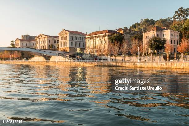 university of deusto on riverbank of nervion river - jesuit stock-fotos und bilder