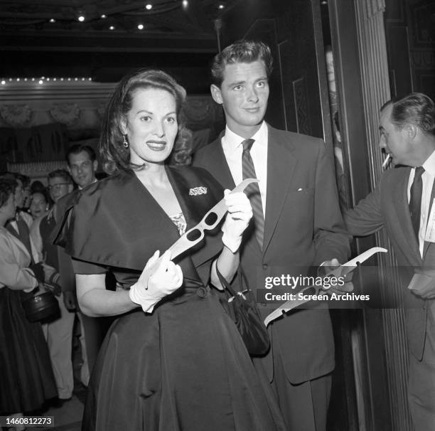 Maureen O'Hara holding 3-D Glasses at the premiere of 'It Came From Outer Space', directed by Jack Arnold, Los Angeles, California, 26th May 1953 .