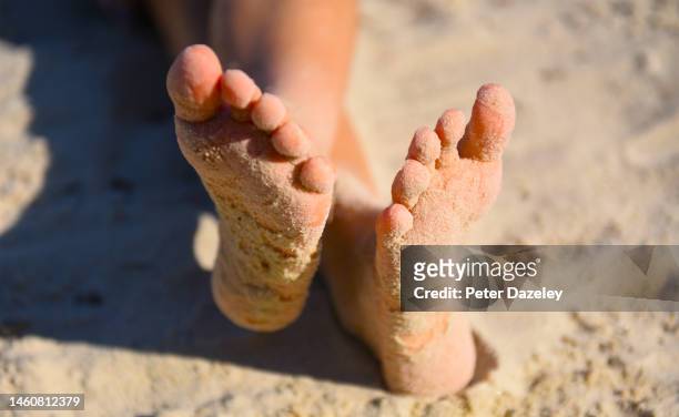boy on beach - tween heels stock pictures, royalty-free photos & images