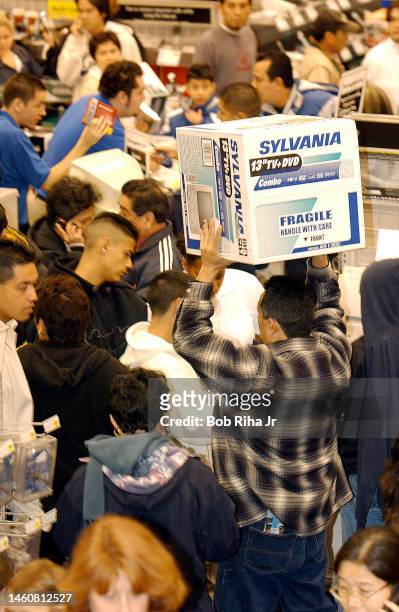 Holiday shoppers at an early-bird sale at Best Buy electronics store, November 28, 2003 in Lakewood, California.