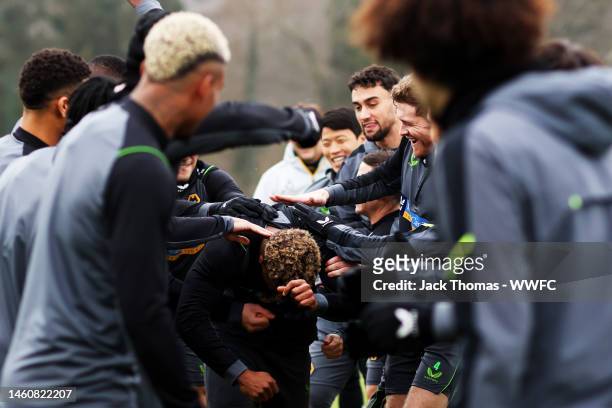 Adama Traore of Wolverhampton Wanderers receives a birthday guard of honour from team mates during a Wolverhampton Wanderers Training Session at The...