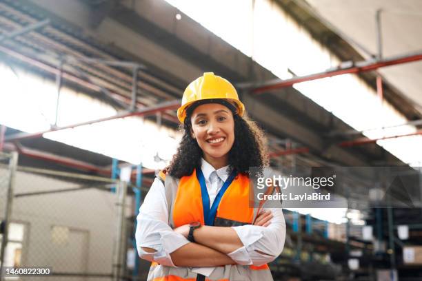 proud, portrait and engineering black woman in factory, warehouse or industry with career vision, mission and goals. happy construction worker, contractor or industrial person with safety gear in job - handyman smiling imagens e fotografias de stock