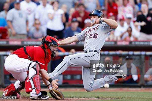 Brennan Boesch of the Detroit Tigers beats the throw to home to score the game-winning run in the eighth inning against the Cincinnati Reds at Great...