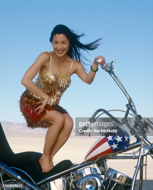 Actress Michelle Yeoh poses for a portrait during a fashion shoot at Coyote Dry Lake Bed for National Geographic magazine in June 1998 near Barstow,...