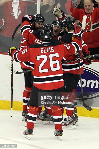 Zach Parise of the New Jersey Devils celebrates with teammates Ilya Kovalchuk, Andy Greene, Patrik Elias and Travis Zajac after Parise scores a goal...