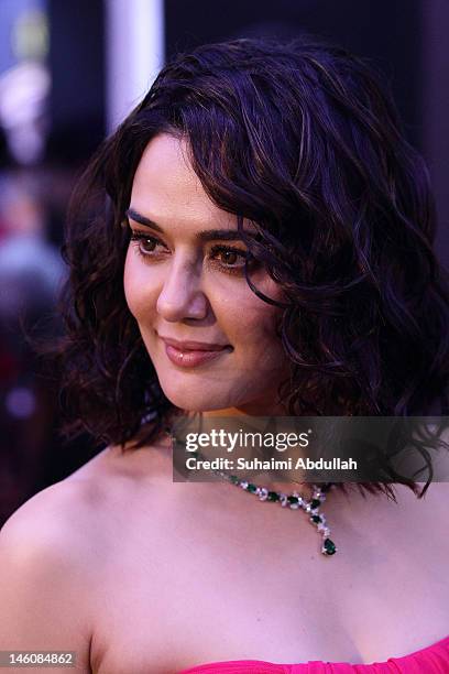 Bollywood actress Preity Zinta poses at the IIFA green carpet event at the 2012 International India Film Academy Awards at the Singapore Indoor...