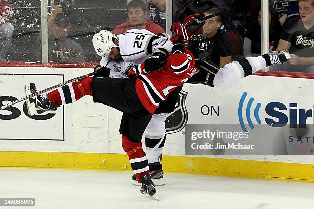 Dustin Penner of the Los Angeles Kings collides with Marek Zidlicky of the New Jersey Devils during Game Five of the 2012 NHL Stanley Cup Final at...