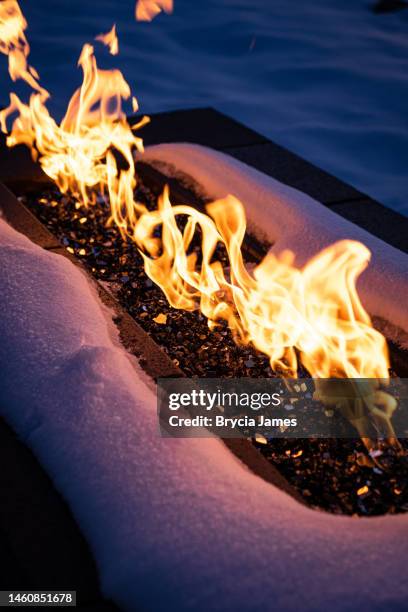 fire pit in the snow - natural gas fireplace stock pictures, royalty-free photos & images