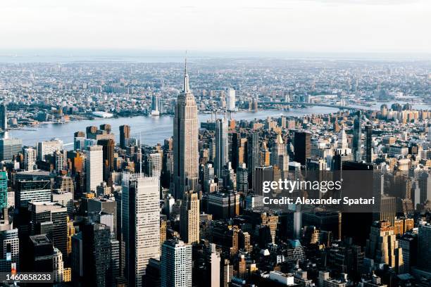 aerial view of new york city cityscape with empire state building, usa - empire state building fotografías e imágenes de stock