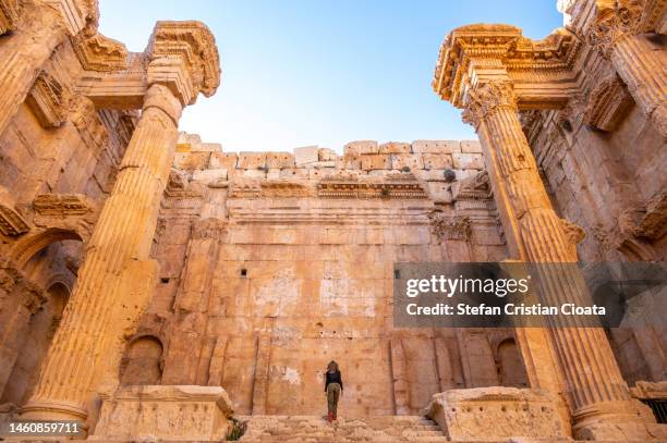 girl exploring the temple of baalbek lebanon - traditional lebanese stock pictures, royalty-free photos & images