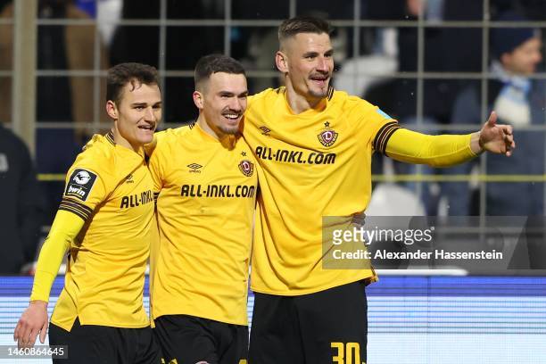 Dennis Borkowski of Dresden celebrates scoring the 2nd team goal with his team mates Stefan Kutschke and Jakob Lemmer during the 3. Liga match...