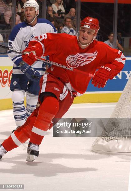 Darren McCarty of the Detroit Red Wings skates against the Toronto Maple Leafs during NHL game action on November 16, 2002 at Air Canada Centre in...