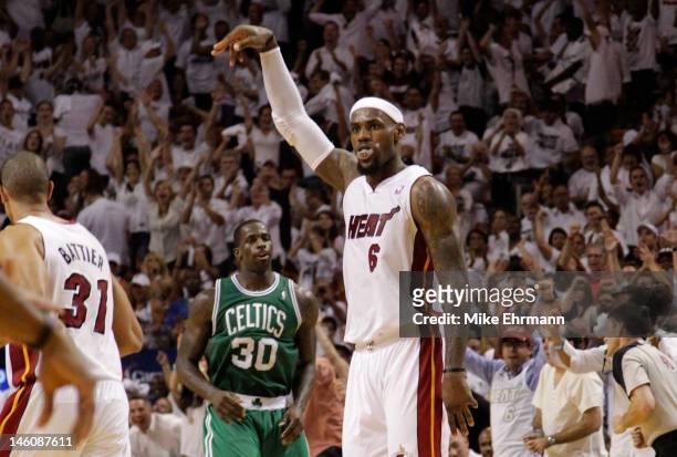 LeBron James of the Miami Heat reacts after making a three-pointer in the fourth quarter against the Boston Celtics in Game Seven of the Eastern...