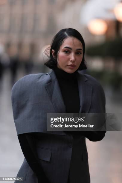 Farah Assaad seen wearing Ezzat official grey suit during Paris Fashion Week on January 26, 2023 in Paris, France.