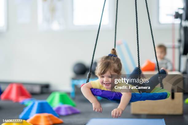 swinging at therapy - swing stock pictures, royalty-free photos & images