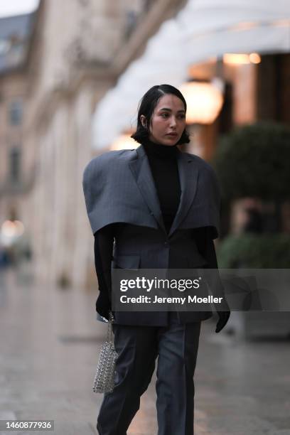 Farah Assaad seen wearing Ezzat official grey suit, small silver Ezzat official bag during Paris Fashion Week on January 26, 2023 in Paris, France.