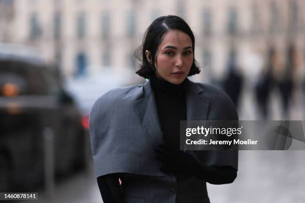 Farah Assaad seen wearing Ezzat official grey suit during Paris Fashion Week on January 26, 2023 in Paris, France.