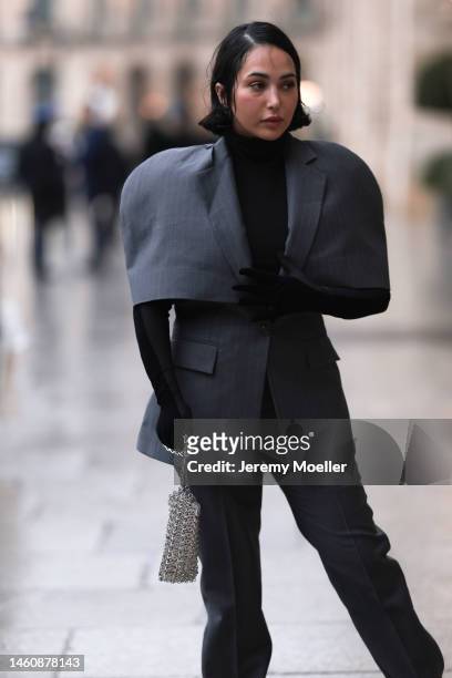 Farah Assaad seen wearing Ezzat official grey suit, small silver Ezzat official bag during Paris Fashion Week on January 26, 2023 in Paris, France.