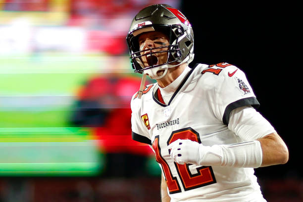 Tom Brady of the Tampa Bay Buccaneers yells as he runs on the field prior to the NFC Wild Card playoff game against the Dallas Cowboys at Raymond...