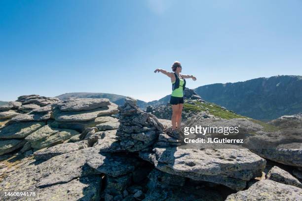 happy woman on top of the mountain achieving her goals - honduras people stock pictures, royalty-free photos & images