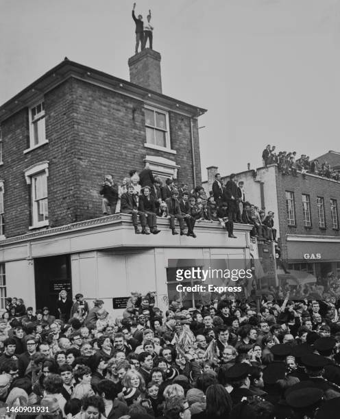 Enthusiastic crowds of West Bromwich Albion fans greet their homecoming team after they beat Everton in the 1968 FA Cup final, fans can be seen on...
