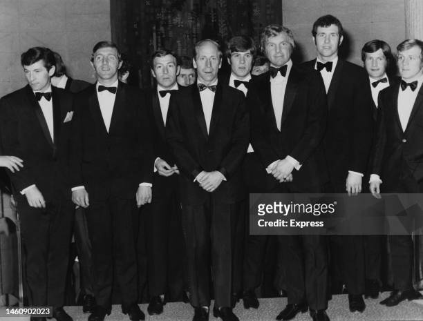 Members of the England World Cup football squad wearing dinner suits to appear on the BBC TV programme 'Top of the Pops' to perform their record...