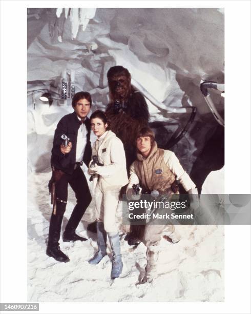 Actor Harrison Ford ,Carrie Fisher, Harrison Ford, Mark Hamill and Peter Mayhew as Chewbacca pose for a portrait on the set of Star Wars: The Empire...