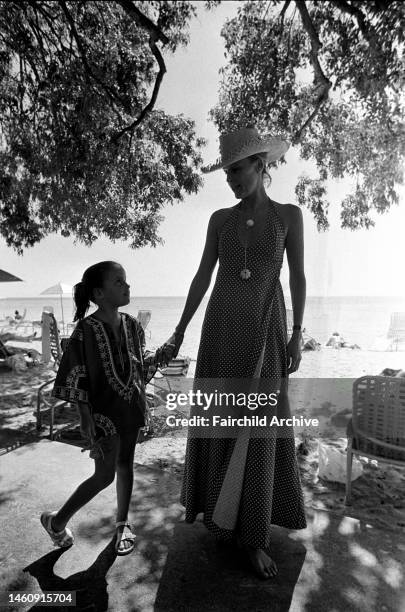 Valerie Unger with her daugher Melissa walking on the beach at the Shady Lane hotel in Barbados