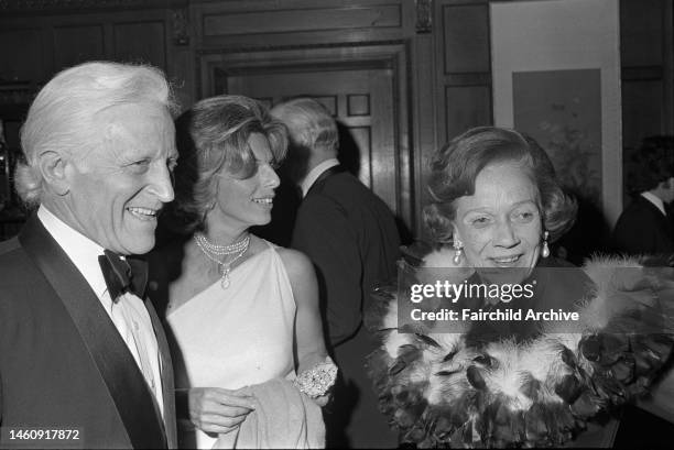 Brooke Astor attending the 'Waltz' evening wearing a feather boa