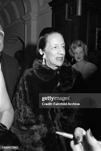 Diana Vreeland attending the 'Waltz' evening in a black fur coat