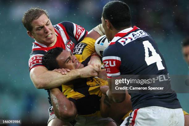 Dunamis Lui of the Broncos is tackled during the round 14 NRL match between the Sydney Roosters and the Brisbane Bronocs at Allianz Stadium on June...