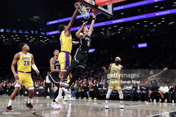 Yuta Watanabe of the Brooklyn Nets goes to the basket as Thomas Bryant of the Los Angeles Lakers defends during the second half at Barclays Center on...