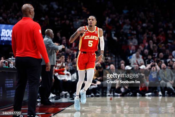 Dejounte Murray of the Atlanta Hawks gestures after making a three-point basket against against the Portland Trail Blazers during the first half at...
