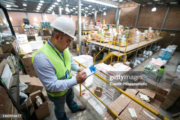 man working at a distribution warehouse - shipping stock pictures, royalty-free photos & images