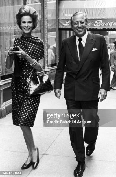 William and Babe Paley walking on a Manhattan street, outside of La Cote Basque.