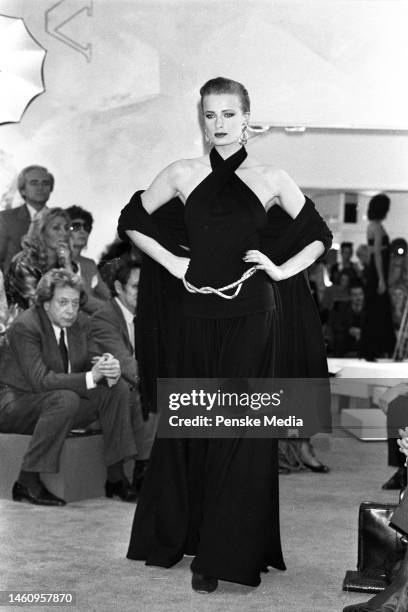 Model on the runway of the Donna Karan fall 1985 ready to wear collection on May 3, 1985 in New York. Article title: 'Dressed Up Days'; Seven Easy...